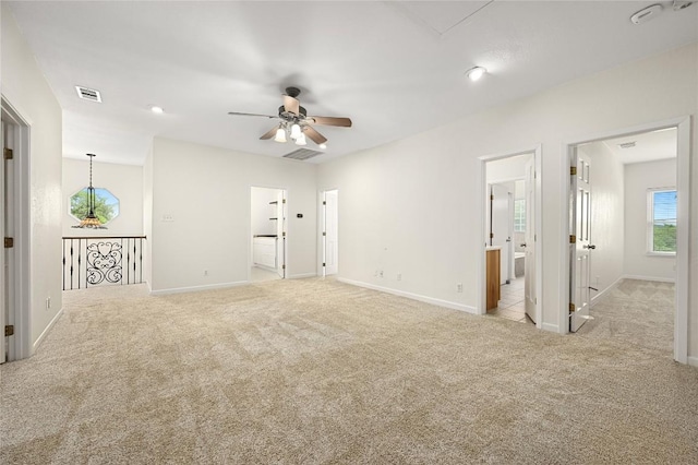 301 Crane St, Austin, TX 78734 - carpeted spare room with a ceiling fan and baseboards