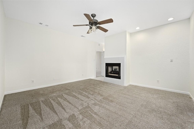301 Crane St, Austin, TX 78734 - unfurnished living room with a ceiling fan, carpet flooring, a tile fireplace, and recessed lighting