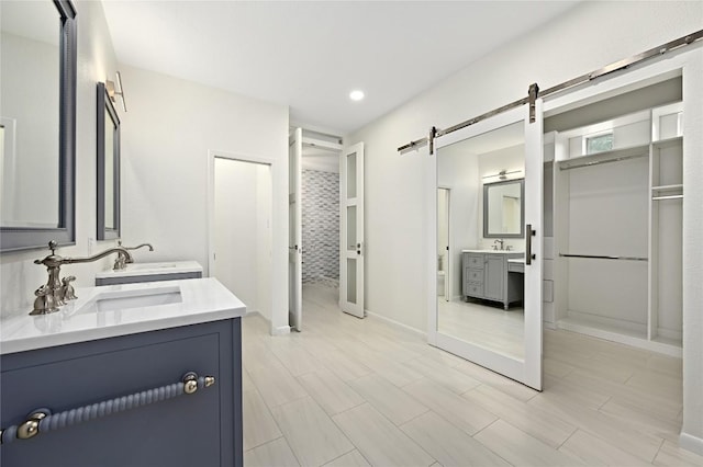 301 Crane St, Austin, TX 78734 - full bath with two vanities, recessed lighting, and a closet