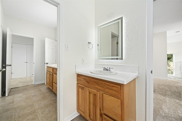 301 Crane St, Austin, TX 78734 - bathroom with two vanities and baseboards
