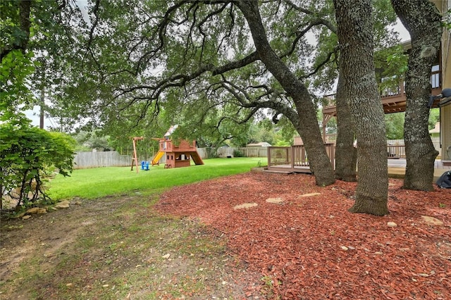 301 Crane St, Austin, TX 78734 - fenced backyard with a playground and a deck