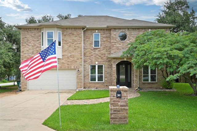 301 Crane St, Austin, TX 78734 - view of front of house with concrete driveway, a front lawn, an attached garage, brick siding, and roof with shingles