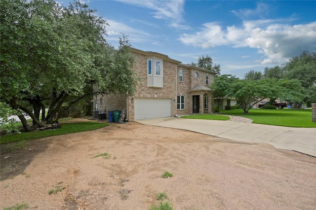 301 Crane St, Austin, TX 78734 - traditional-style home featuring concrete driveway, a garage, a front yard, and brick siding