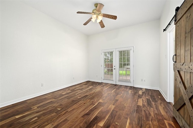 301 Crane St, Austin, TX 78734 - unfurnished bedroom featuring a barn door, access to exterior, french doors, dark wood finished floors, and a ceiling fan