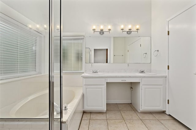 301 Crane St, Austin, TX 78734 - full bath featuring double vanity, a bath, and tile patterned flooring