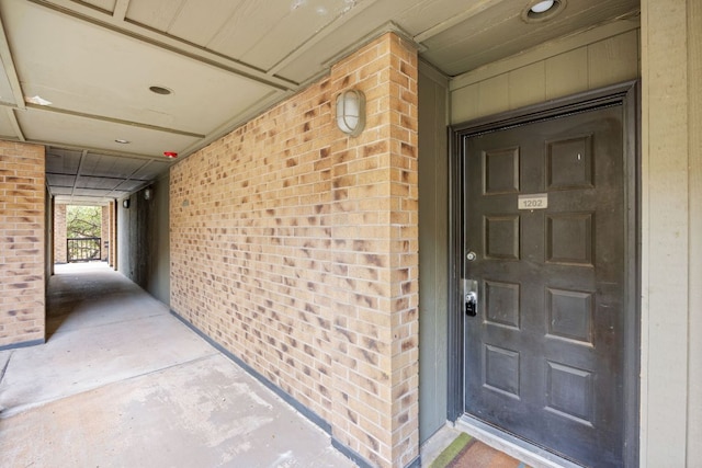 8888 Tallwood Dr Unit 1202, Austin, TX 78759 - doorway to property with brick siding