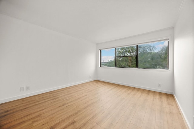 8888 Tallwood Dr Unit 1202, Austin, TX 78759 - spare room featuring wood finished floors and baseboards