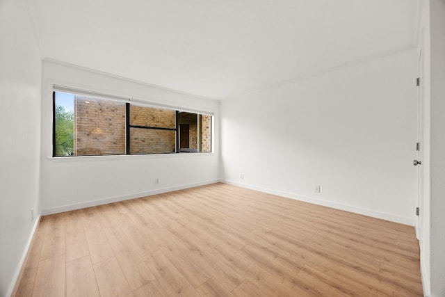 8888 Tallwood Dr Unit 1202, Austin, TX 78759 - unfurnished room featuring light wood finished floors and baseboards