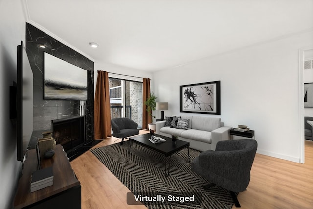 8888 Tallwood Dr Unit 1202, Austin, TX 78759 - living room with a premium fireplace and wood finished floors