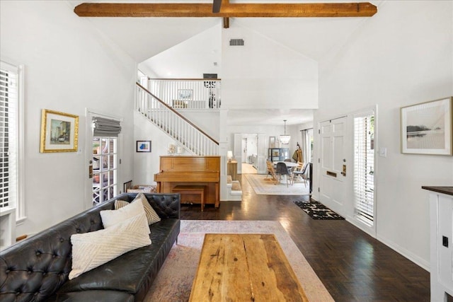 2616 Jefferson St Unit A, Austin, TX 78703 - living area featuring high vaulted ceiling, wood finished floors, beamed ceiling, healthy amount of natural light, and stairs