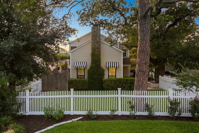 2616 Jefferson St Unit A, Austin, TX 78703 - view of front of home with a chimney and a fenced front yard