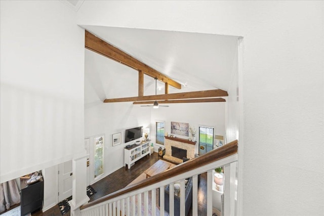2616 Jefferson St Unit A, Austin, TX 78703 - staircase with high vaulted ceiling, beam ceiling, ceiling fan, wood finished floors, and a fireplace with raised hearth