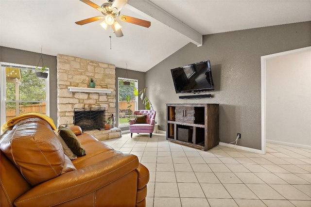 809 Windsor Rd, Round Rock, TX 78664 - living room featuring a stone fireplace, light tile patterned flooring, and ceiling fan