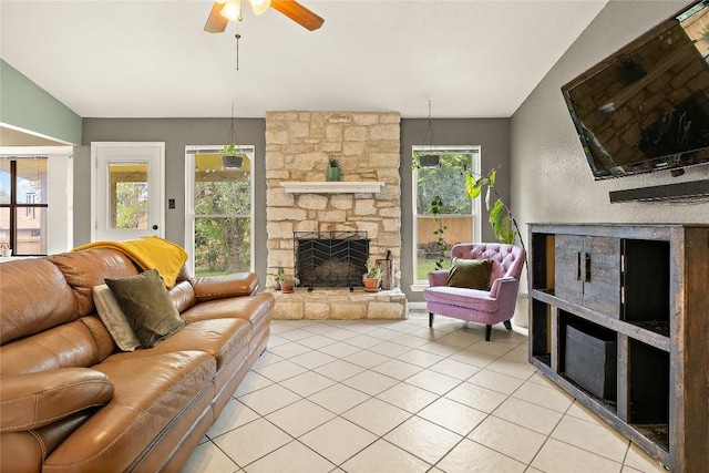 809 Windsor Rd, Round Rock, TX 78664 - living area with a stone fireplace, light tile patterned floors, and a ceiling fan