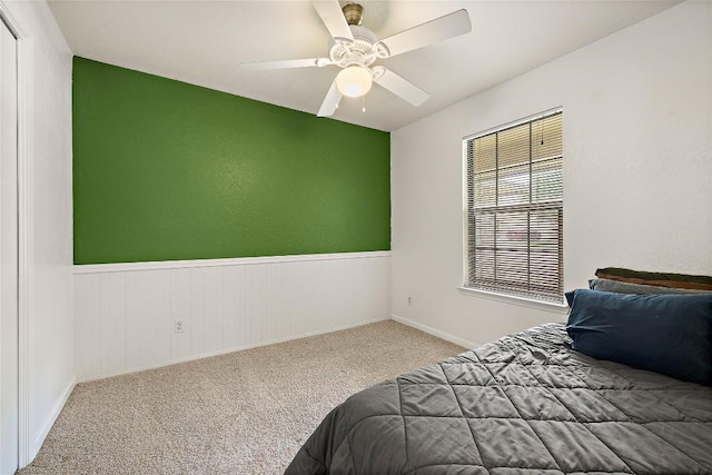 809 Windsor Rd, Round Rock, TX 78664 - carpeted bedroom with ceiling fan and a wainscoted wall