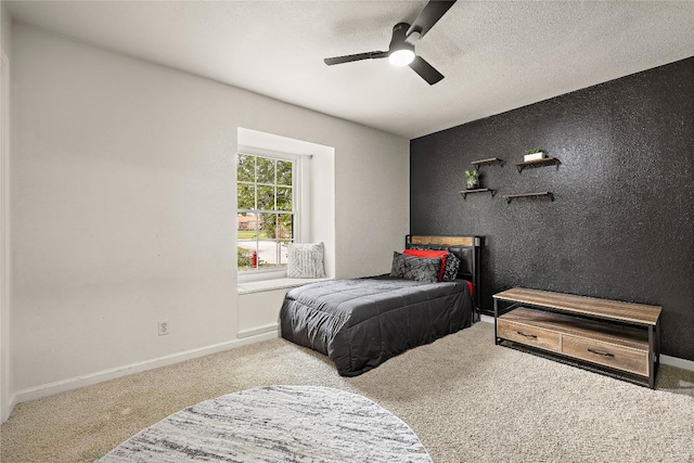 809 Windsor Rd, Round Rock, TX 78664 - bedroom featuring carpet flooring, ceiling fan, and a textured ceiling