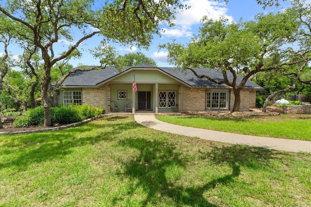 11302 Centennial Trl, Austin, TX 78726 - ranch-style house with a front yard and a porch