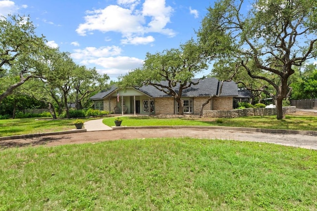 11302 Centennial Trl, Austin, TX 78726 - view of front of house featuring a front lawn, curved driveway, and brick siding