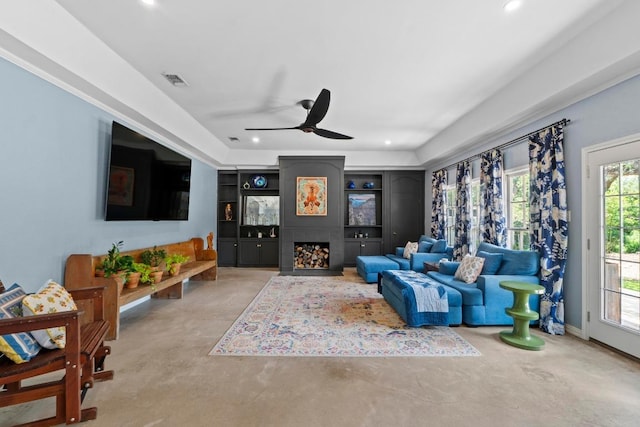 11302 Centennial Trl, Austin, TX 78726 - living room with recessed lighting, ceiling fan, concrete flooring, and a fireplace
