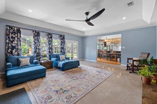 11302 Centennial Trl, Austin, TX 78726 - living area featuring a ceiling fan, a tray ceiling, french doors, recessed lighting, and concrete flooring