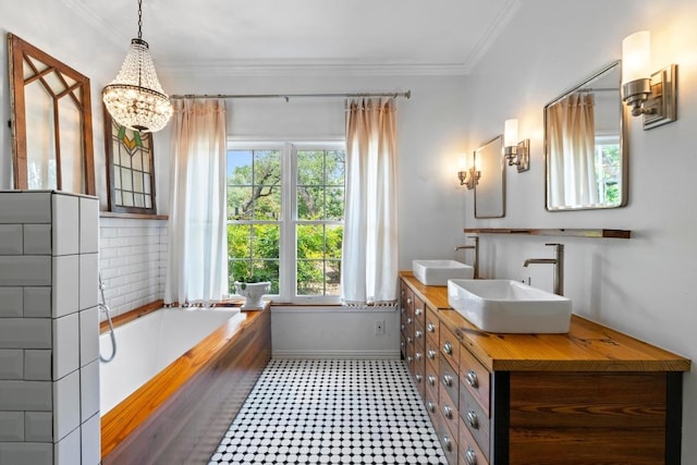 11302 Centennial Trl, Austin, TX 78726 - full bathroom featuring tile patterned floors, double vanity, a garden tub, a chandelier, and crown molding