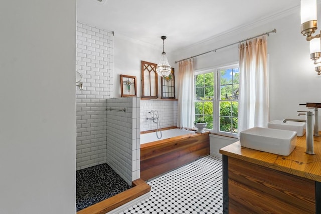11302 Centennial Trl, Austin, TX 78726 - bathroom featuring a chandelier, double vanity, a bath, tiled shower, and crown molding