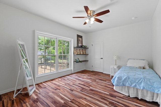 11302 Centennial Trl, Austin, TX 78726 - bedroom with wood finished floors and a ceiling fan