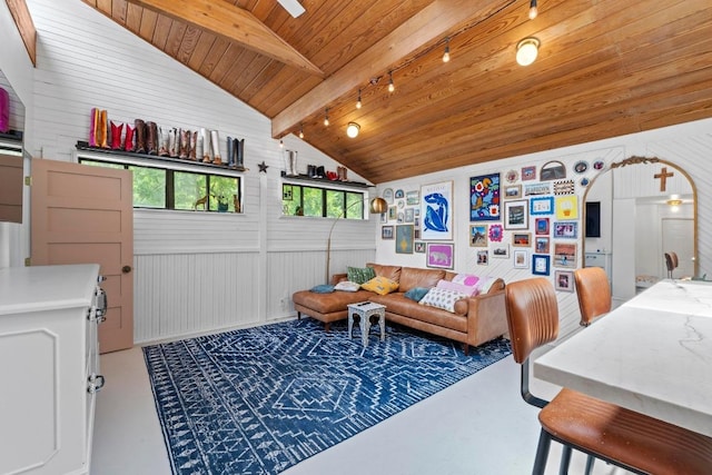 11302 Centennial Trl, Austin, TX 78726 - living area with concrete flooring, arched walkways, wood ceiling, rail lighting, and wooden walls