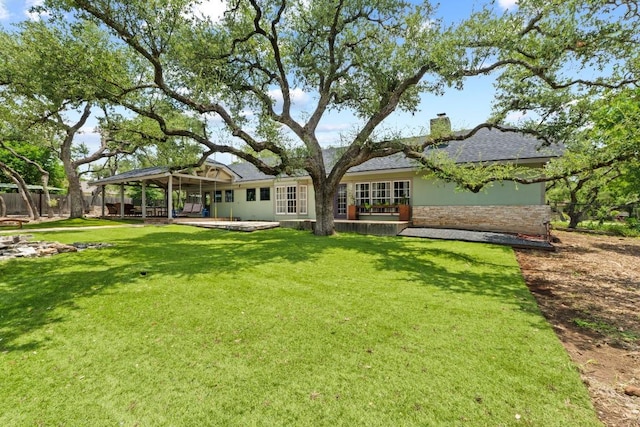 11302 Centennial Trl, Austin, TX 78726 - back of property with a chimney, stone siding, a shingled roof, and stucco siding
