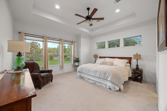 707 Campino Dr, Cedar Park, TX 78613 - bedroom featuring a tray ceiling, light carpet, recessed lighting, and ceiling fan