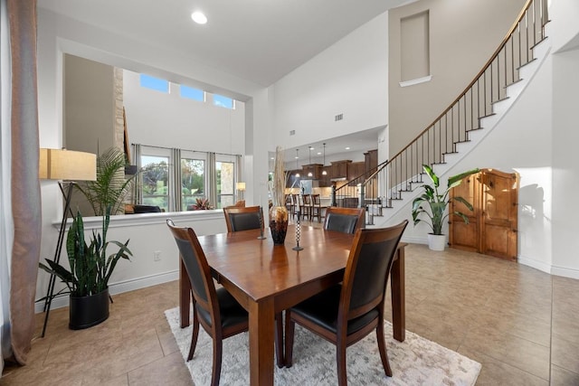 707 Campino Dr, Cedar Park, TX 78613 - dining room with a high ceiling, stairs, light tile patterned floors, and recessed lighting