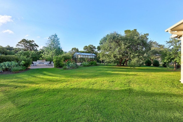 707 Campino Dr, Cedar Park, TX 78613 - view of grassy yard featuring an exterior structure, an outdoor structure, and a patio