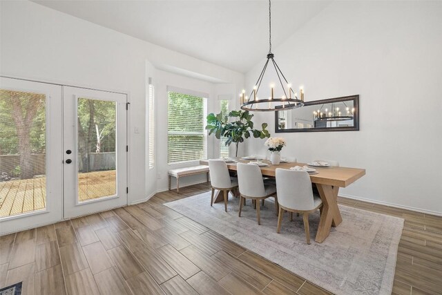 2901 Rochelle Dr, Austin, TX 78748 - dining space with a chandelier, lofted ceiling, wood finished floors, and french doors