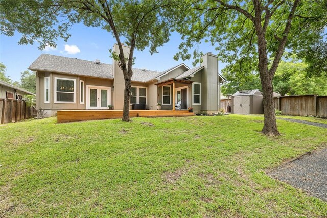 2901 Rochelle Dr, Austin, TX 78748 - rear view of house featuring french doors, a storage unit, a wooden deck, and a fenced backyard