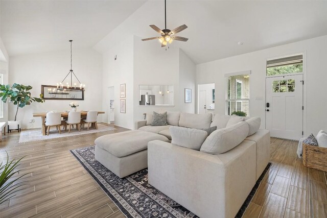 2901 Rochelle Dr, Austin, TX 78748 - living area with a chandelier, high vaulted ceiling, light wood-style floors, and a ceiling fan