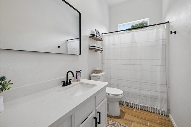 2901 Rochelle Dr, Austin, TX 78748 - full bathroom featuring vanity, wood finished floors, and a shower with curtain