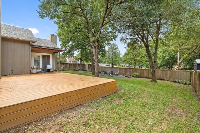 2901 Rochelle Dr, Austin, TX 78748 - fenced backyard with a wooden deck and french doors