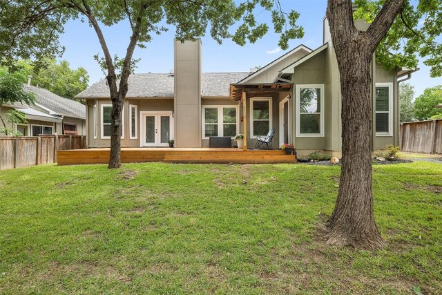 2901 Rochelle Dr, Austin, TX 78748 - back of property with a wooden deck, french doors, a chimney, and roof with shingles