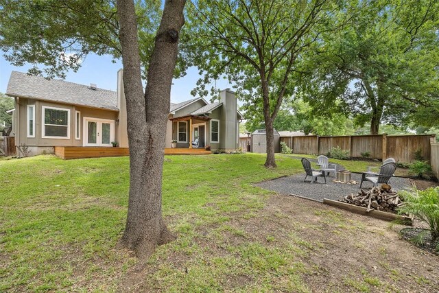 2901 Rochelle Dr, Austin, TX 78748 - view of yard featuring french doors and a fire pit