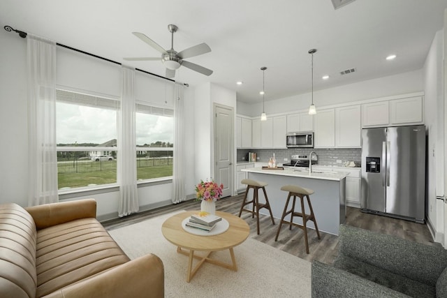 409 July Johnson Dr, Austin, TX 78737 - living room with a ceiling fan, dark wood finished floors, and recessed lighting