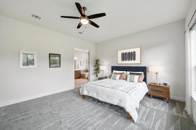409 July Johnson Dr, Austin, TX 78737 - bedroom with carpet flooring, connected bathroom, and a ceiling fan