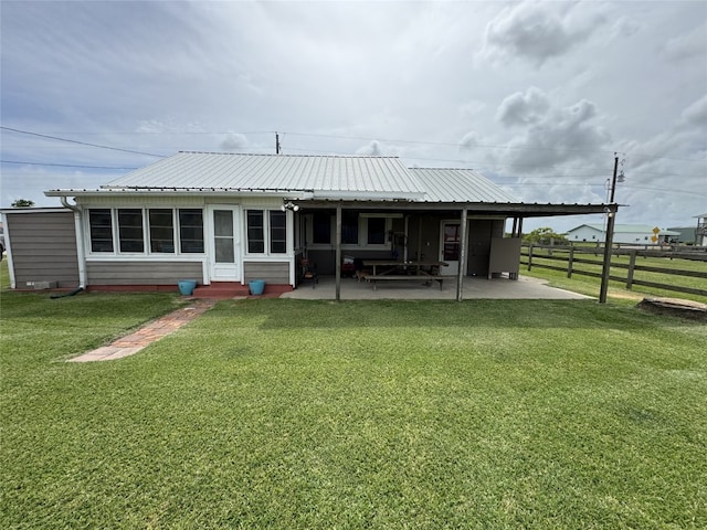 549 Marshall Johnson Ave S, Port Lavaca, TX 77979 - rear view of property featuring a patio and a metal roof