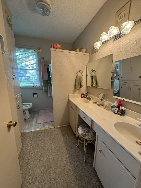 549 Marshall Johnson Ave S, Port Lavaca, TX 77979 - full bathroom featuring a textured ceiling and double vanity