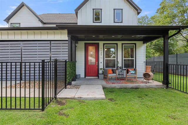 1125 Tillery St Unit 1A, Austin, TX 78702 - view of exterior entry featuring a porch, board and batten siding, and roof with shingles