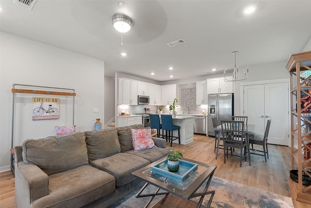 1125 Tillery St Unit 1A, Austin, TX 78702 - living room with light wood-type flooring, recessed lighting, and a ceiling fan