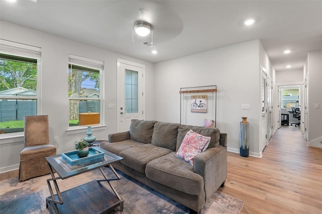 1125 Tillery St Unit 1A, Austin, TX 78702 - living room featuring light wood-style flooring and recessed lighting
