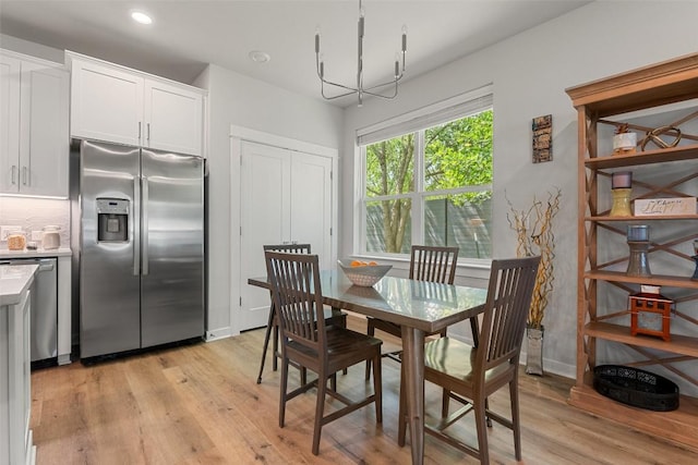 1125 Tillery St Unit 1A, Austin, TX 78702 - dining room with light wood finished floors, a chandelier, and recessed lighting