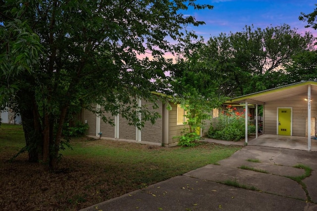 2021 Wheless Ln, Austin, TX 78723 - view of front facade with a lawn and concrete driveway
