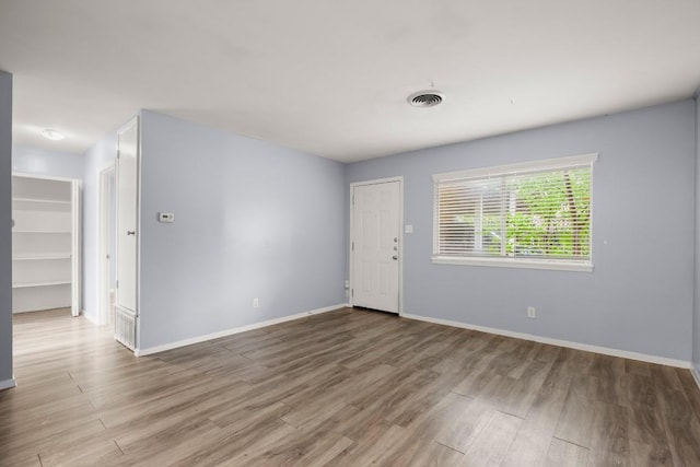 2021 Wheless Ln, Austin, TX 78723 - empty room featuring wood finished floors and baseboards