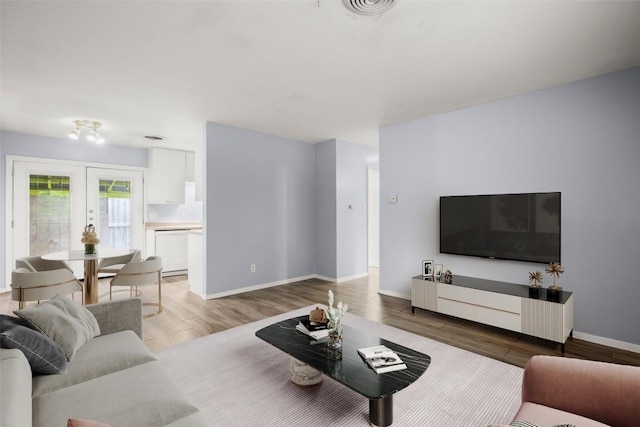 2021 Wheless Ln, Austin, TX 78723 - living room featuring wood finished floors and french doors